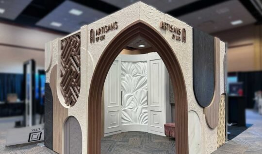 Home reno show booth displaying creative finishes, a organic sculpture and custom furnishings.